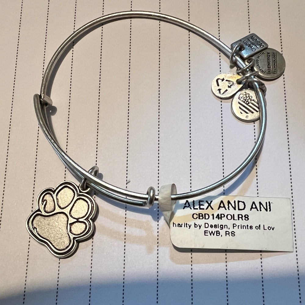 Alex and Ani 2016 Paws Print charm bangle in silvertone with tag.